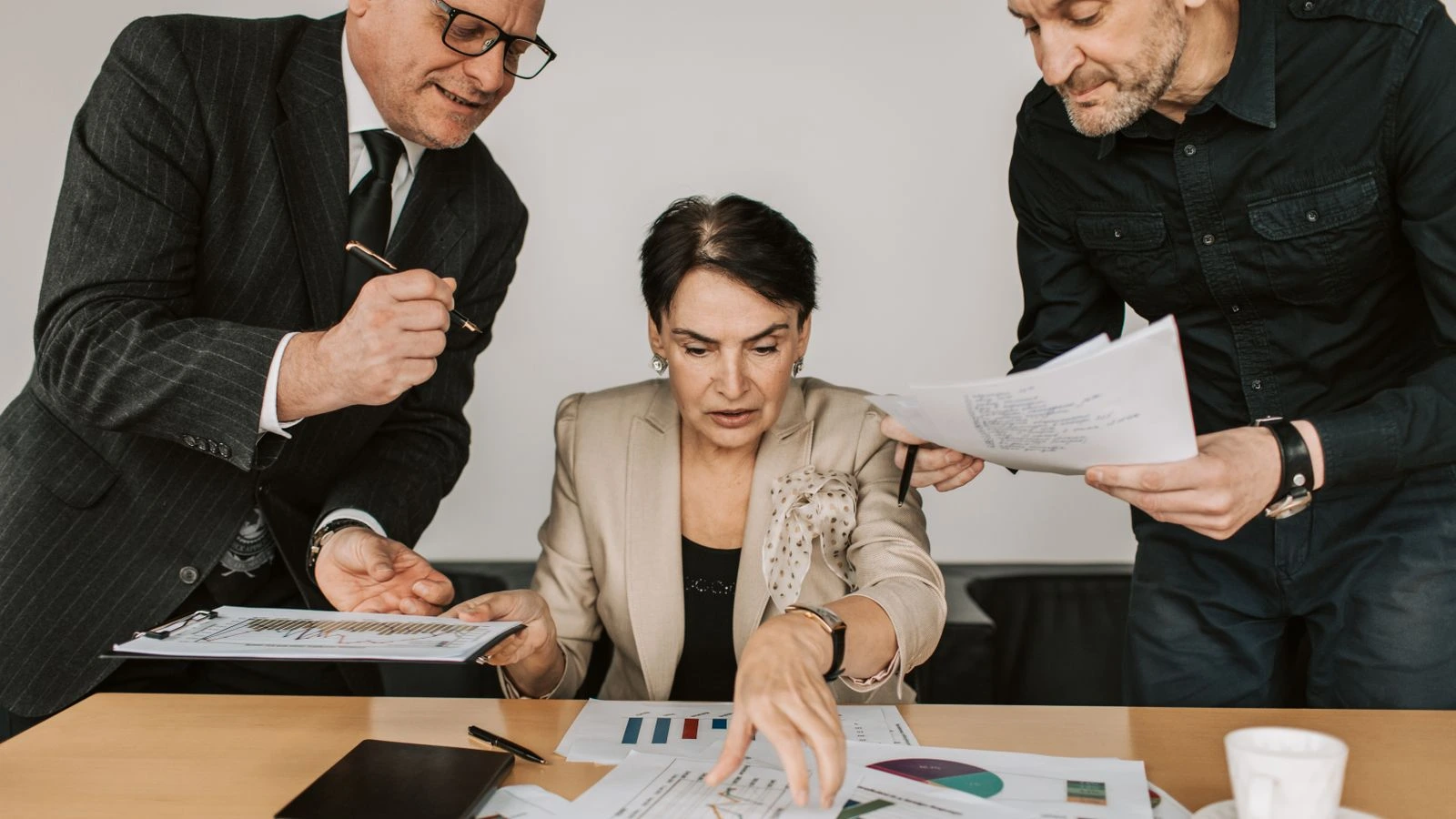 Business team collaborates on financial strategies during an office meeting