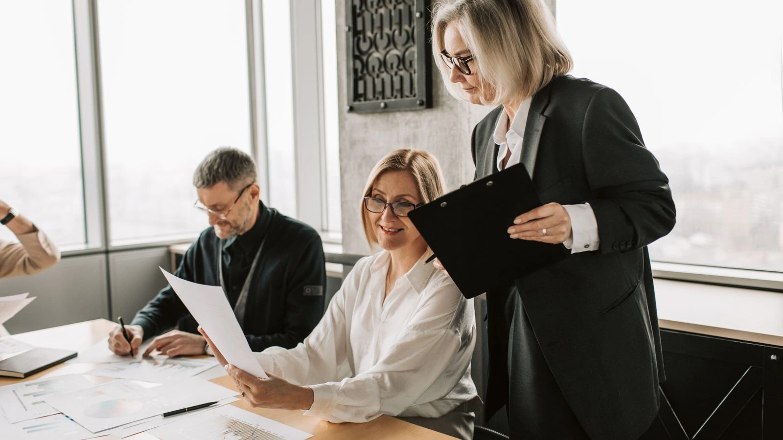 Team of business professionals collaborating in a modern office setting